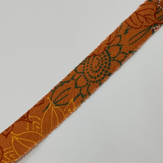 落ち着いた橙色に茶黄緑紫の向日葵柄・縮緬(Y02008089)