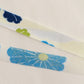 薄い卵色に赤・緑・青・黄の花柄・化繊(Y02601004）